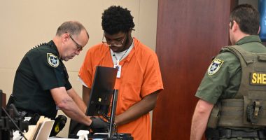Brendan Depa getting finger-printed after his sentencing hearing on Aug. 6, 2024. (© FlaglerLive)