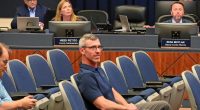Deputy County Attorney Sean Moylan, right, at an April meeting of the County Commission. (© FlaglerLive)