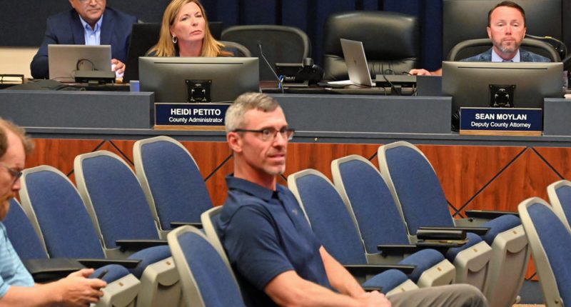 Deputy County Attorney Sean Moylan, right, at an April meeting of the County Commission. (© FlaglerLive)