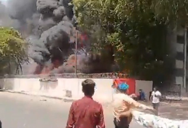 Shocking new footage taken just outside the medical college the plane crashed into showed him calmly walking away as an inferno raged just a few metres behind him