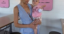Em Davies (pictured with Isla Sue) was stranded in an airport for four hours while travelling on her own with her nine-month-old baby for the first time
