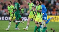 Pictured left to right: Socceroos stars Martin Boyle, Connor Metcalfe and Aiden O'Neill begin to celebrate the 2-1 win over Saudi Arabia in Jeddah