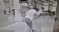 Appalling footage shows the moment a male tourist suddenly picks up and hurls a helpless 18-month-old boy head first on the ground in the arrivals hall of a Moscow airport