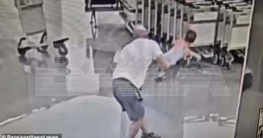 Appalling footage shows the moment a male tourist suddenly picks up and hurls a helpless 18-month-old boy head first on the ground in the arrivals hall of a Moscow airport
