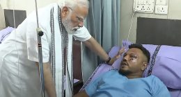 Briton Vishwash Kumar Ramesh, 40, miraculously survived the plane disaster. Pictured: Prime Minister Narendra Modi (L) meeting with Vishwash Kumar Ramesh in an Ahmedabad hospital on Friday