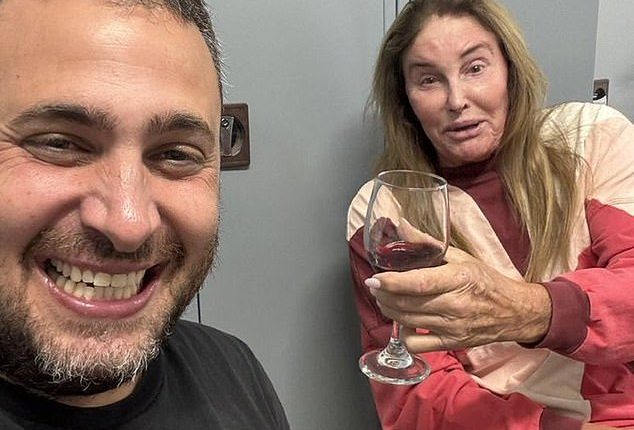 Caitlyn Jenner was drinking wine and texting members of her family while bombs rained down near her Tel Aviv hotel on Friday night, the Daily Mail can reveal