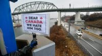 American ‘Elbows Up for Canada’ protesters gather near The Peace Bridge border crossing in Buffalo, N.Y., in April 2025.