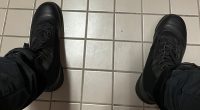 The shooter shared an image of his own feet clad in black leather combat boots while sat in a toilet cubicle on the third floor of the school moments before launching the attack