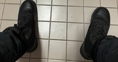 The shooter shared an image of his own feet clad in black leather combat boots while sat in a toilet cubicle on the third floor of the school moments before launching the attack