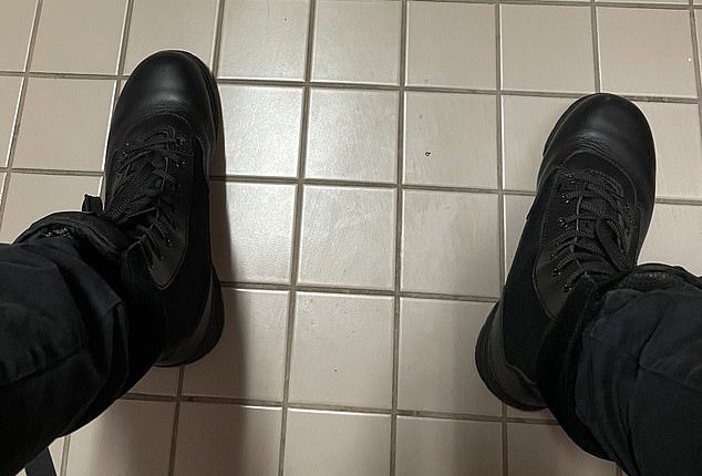 The shooter shared an image of his own feet clad in black leather combat boots while sat in a toilet cubicle on the third floor of the school moments before launching the attack