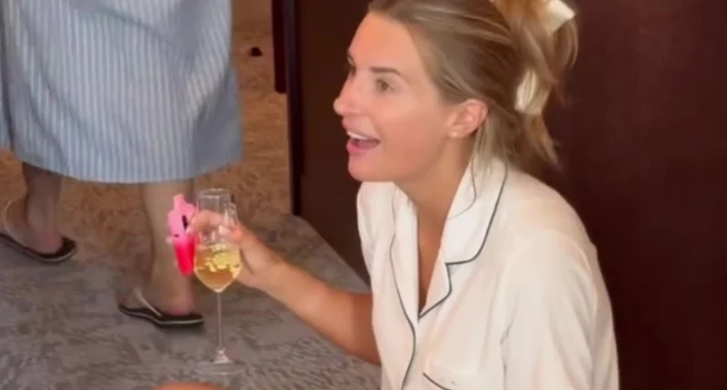 Dani Dyer shares behind-the-scenes snaps of her wedding morning as she sips champagne and clutches a vape