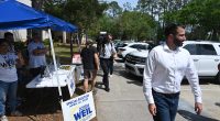 Josh Weil campaigning in Palm Coast on the last day of the special election  for a congressional seat last April 1, which he lost to Randy Fine. (© FlaglerLive)