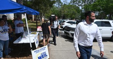 Josh Weil campaigning in Palm Coast on the last day of the special election  for a congressional seat last April 1, which he lost to Randy Fine. (© FlaglerLive)