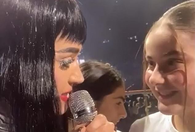 Katy Perry shared a sweet moment with a young fan at her Sydney show on Wednesday night. During the set, Perry invited a young fan called Tiana on stage, with the little girl admitting she was missing out on studying for an exam to attend the show