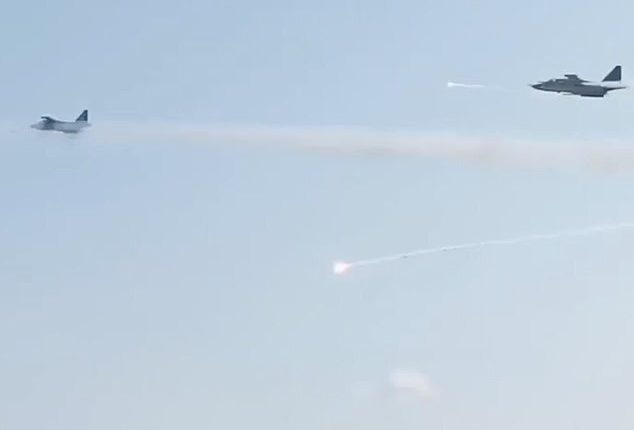 The footage shows heat trap flares and possible missiles from the Su-25s