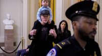 Elon Musk on Capitol Hill last month with son X; Katie Miller stands behind him