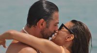 Eva Longoria rocks cheeky orange swimsuit as she packs on PDA with husband Jose Baston on beach in Spain