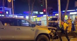 The man and woman were seen trying to kick in the windshield of a vehicle following a crash, before the pair fled the scene (pictured)