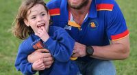 Four-year-old Marigold Jessie has been rushed home to Australia after a fall from a Balinese tree house caused a brain bleed (pictured in her local football club's colours)
