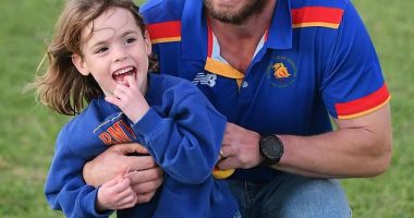 Four-year-old Marigold Jessie has been rushed home to Australia after a fall from a Balinese tree house caused a brain bleed (pictured in her local football club's colours)