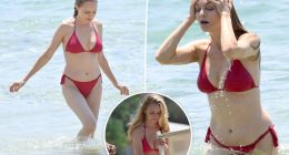 Heather Graham, 55, beats the heat in tiny red bikini during beach day in Sardinia