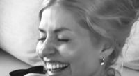 Holly Willoughby looks happier than ever as she poses in her bikini and cuddles two pals