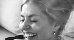 Holly Willoughby looks happier than ever as she poses in her bikini and cuddles two pals