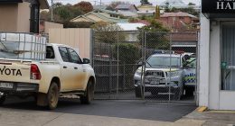 The body of a homeless man was found in an industrial bin behind Salvos Stores Bellerive. Pictured are police at the scene