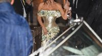 Bride-to-be Lauren Sanchez sought refuge under an umbrella after a freak thunderstorm hit the couple's first pre-wedding party on Thursday