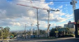 Pennant Hills Road is empty as crews assess a crane that could fall due to high winds