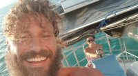 Thomas Goertz says he is exactly what he looks like - a carefree, seasoned sailor who loves the independence and romance of chasing adventure on the high seas. He is pictured with partner Jade Ormiston