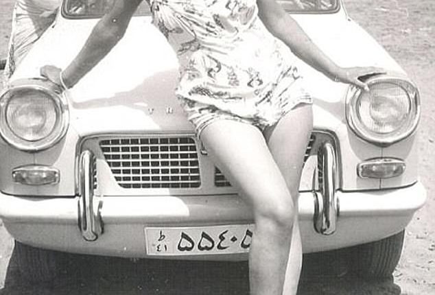 Under the rule of King Shah Mohammad Reza Pahlavi, who was an ally of Britain and the U.S., the hijab was even banned because it was argued it suppressed women. Above: An Iranian woman poses in a swimsuit at the beach in Iran
