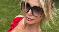Lizzie Cundy looks stunning as she soaks up the sun in plunging red swimsuit