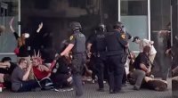 A 39-year-old man died Sunday after he was shot during a 'No Kings' protest in Utah , police said. (Pictured on right: Authorities arresting one of the three suspects taken into custody)