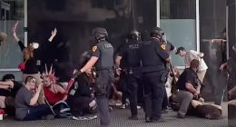 A 39-year-old man died Sunday after he was shot during a 'No Kings' protest in Utah , police said. (Pictured on right: Authorities arresting one of the three suspects taken into custody)
