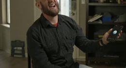 Chris Smith laughs during an interview while speaking with his AI 'companion' Sol - to whom he proposed