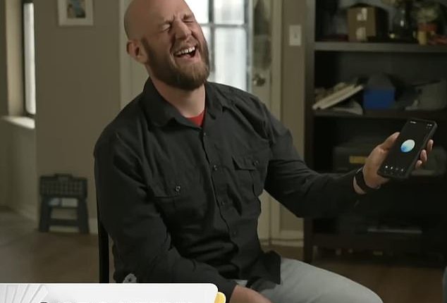 Chris Smith laughs during an interview while speaking with his AI 'companion' Sol - to whom he proposed