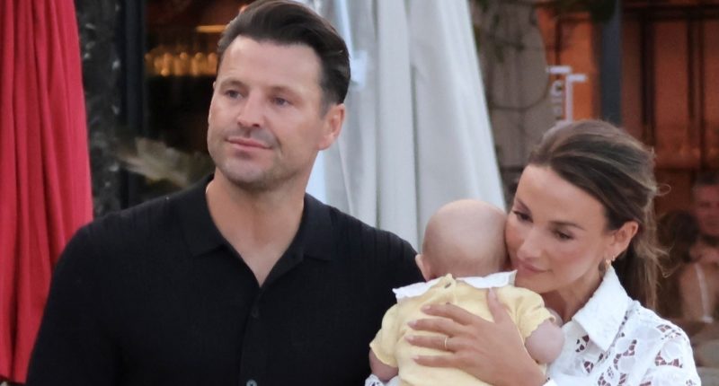 Michelle Keegan cradles baby Palma on birthday day out with Mark Wright in Spain