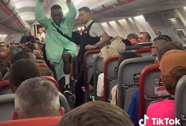A 'feral' Brit has been captured attempting to provoke another passenger on a chaotic 'flight from hell' to Ibiza