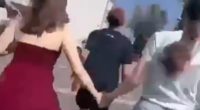 Terror-stricken pupils are seen running down a corridor and a flight of stairs as they are escorted out of the building by heavily armed cops