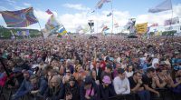 Mystery as huge billboard goes up outside Glastonbury Festival – and fans think it’s a hint at secret set