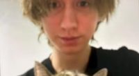 Arthur A holds a cat in the first images to emerge since the horrifying attack in Graz