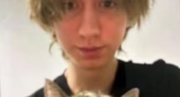 Arthur A holds a cat in the first images to emerge since the horrifying attack in Graz