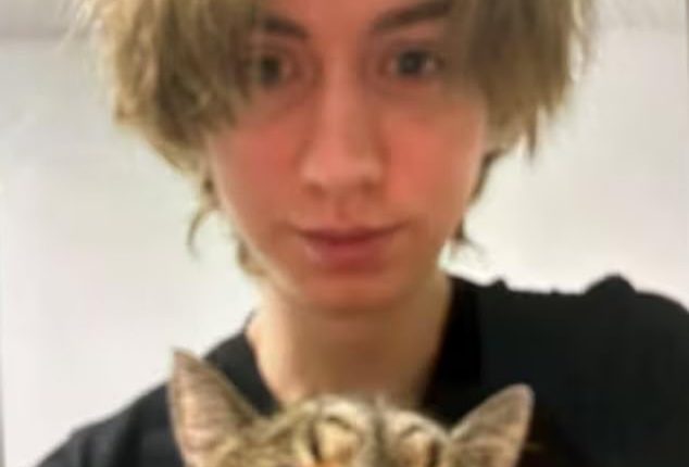 Arthur A holds a cat in the first images to emerge since the horrifying attack in Graz
