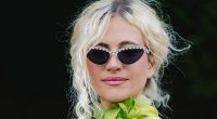 Pixie Lott cradles her baby bump in green dress days after announcing second pregnancy live on stage