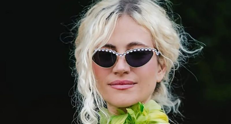 Pixie Lott cradles her baby bump in green dress days after announcing second pregnancy live on stage