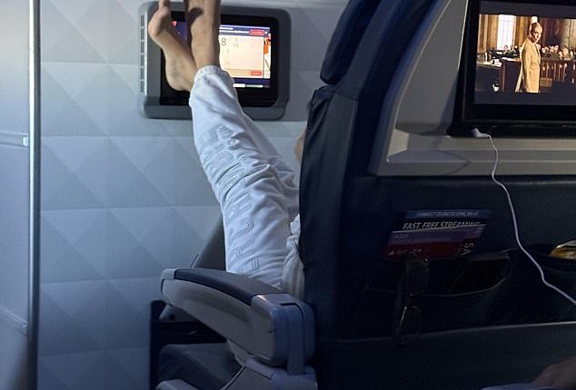 A woman on a recent Delta flight horrified fellow passengers after propping her bare feet without socks on the TV screen in front of her