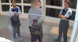 CCTV captured the moment a watch house officer asked an Indigenous teen if he would 'neck himself'