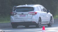 A 34-year-old passenger of a Subaru sedan (pictured) has been been arrested of he stabbed a 40-year-man following a two-vehicle collision in Neath, NSW