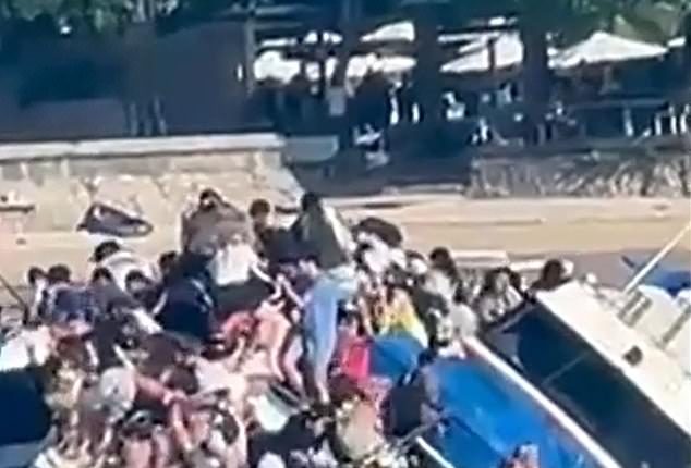 A tourist boat carrying 89 people sank (pictured) off the coast of Bali on Wednesday